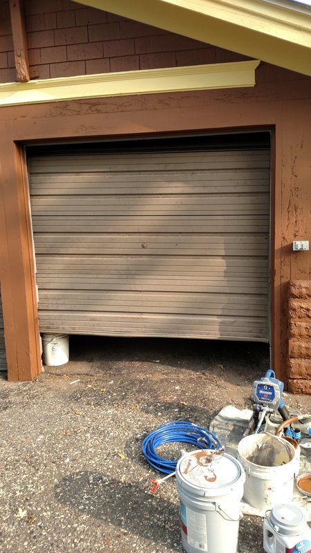 Close-up of door trim being painted