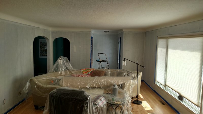 Living room primed and masked before painting
