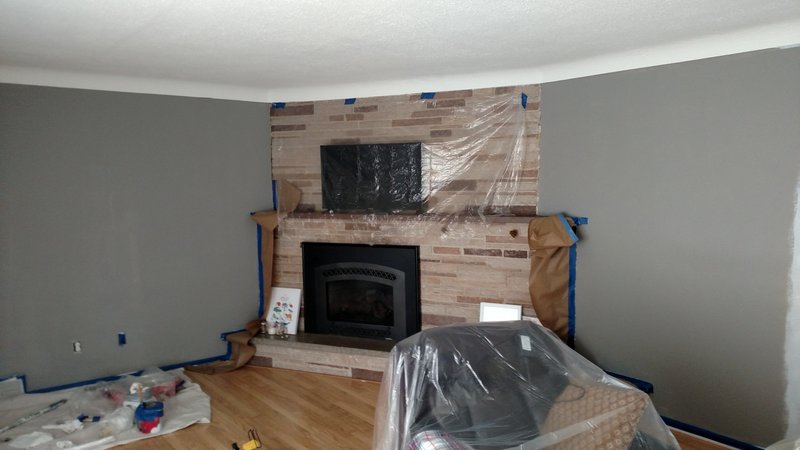 Fireplace wall painted with masking still in place