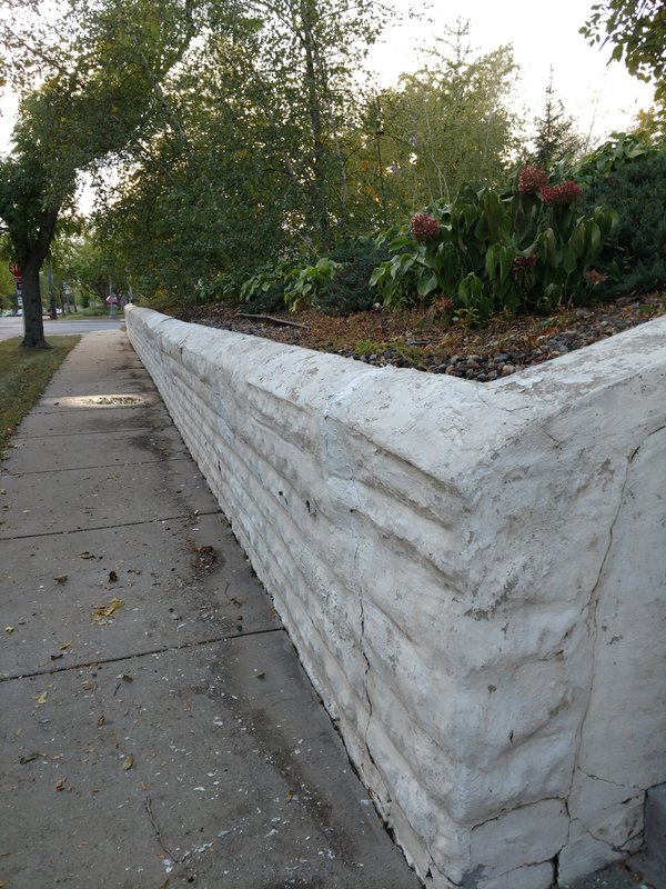Long view of weathered retaining wall