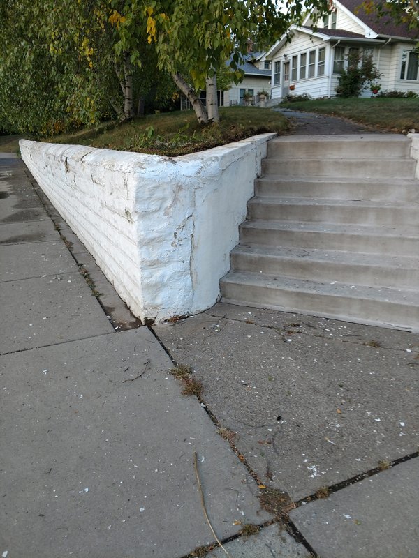 Retaining wall and concrete steps before work