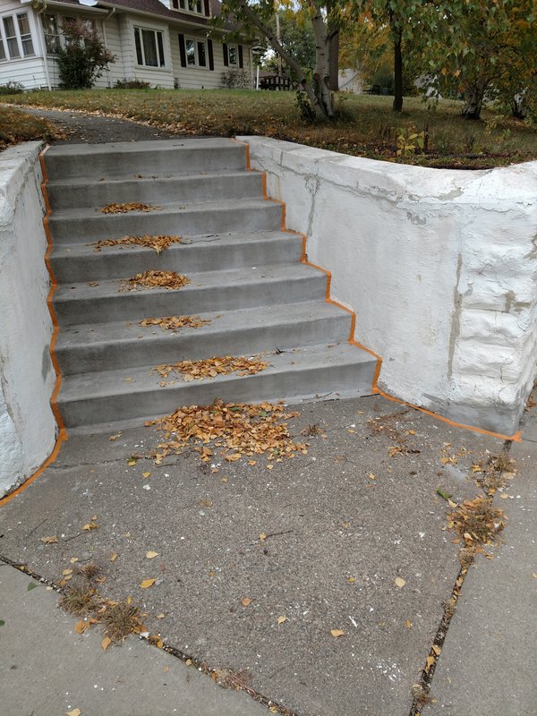Steps and walls mid-refinish with painter tape