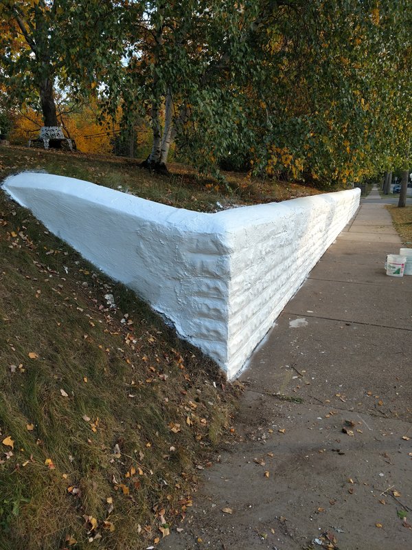 Finished tiered retaining wall corner